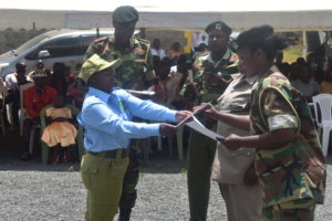 Forest Scout receiving a Certificate from Kenya Forest Service