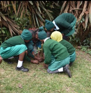 Planting a tree with girls from Kerarapon Primary School