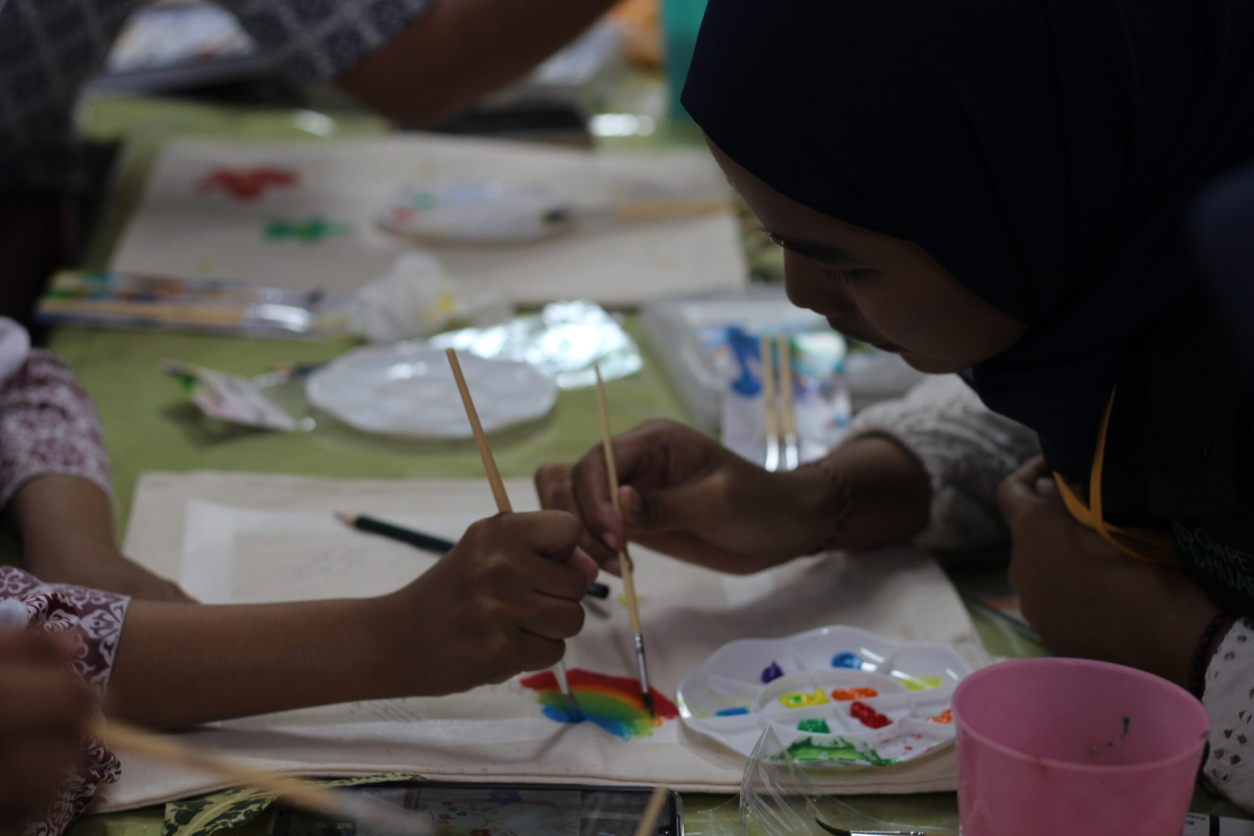 Two children with special needs painting