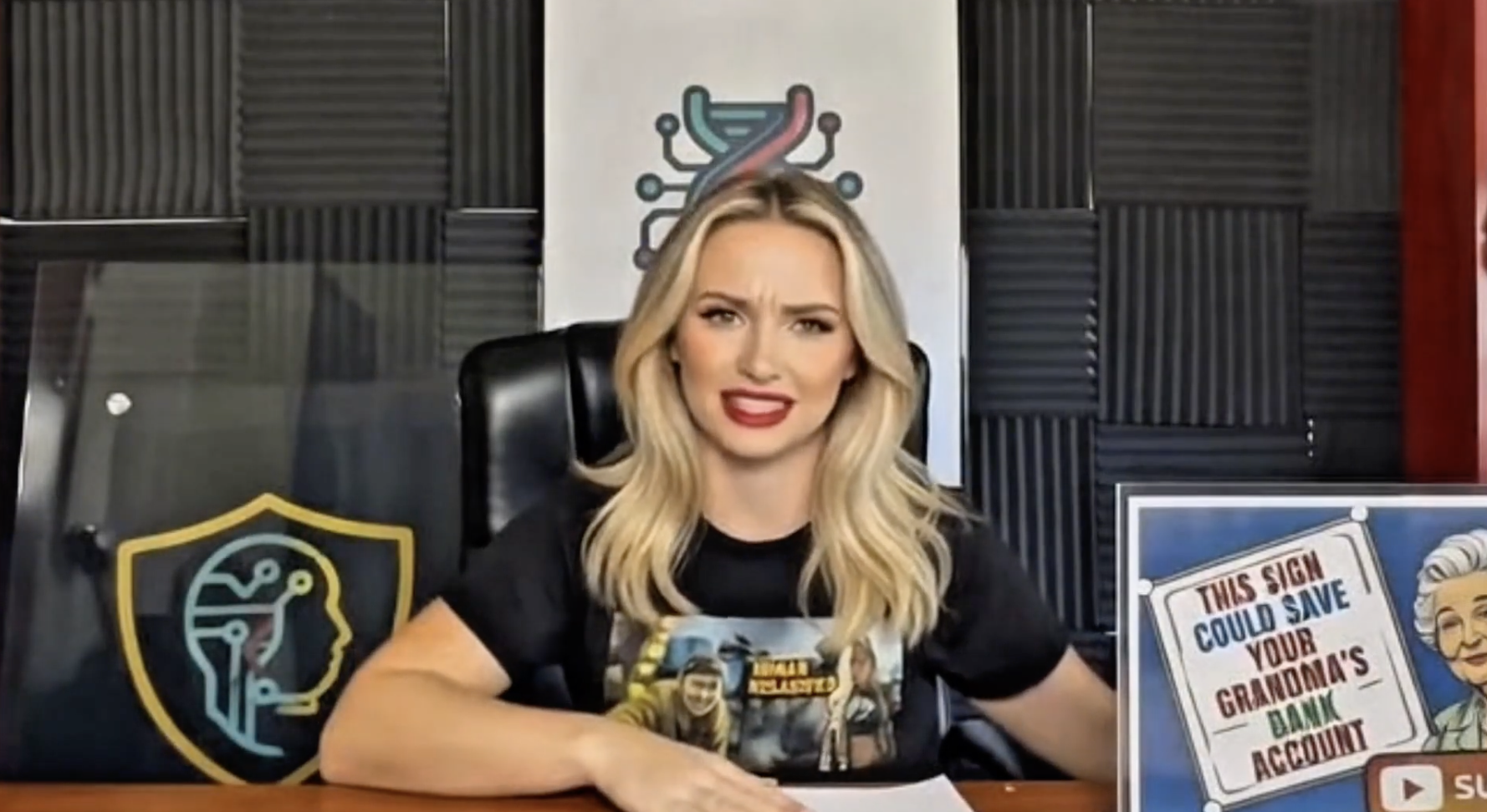 An artist in front a mural with arms open