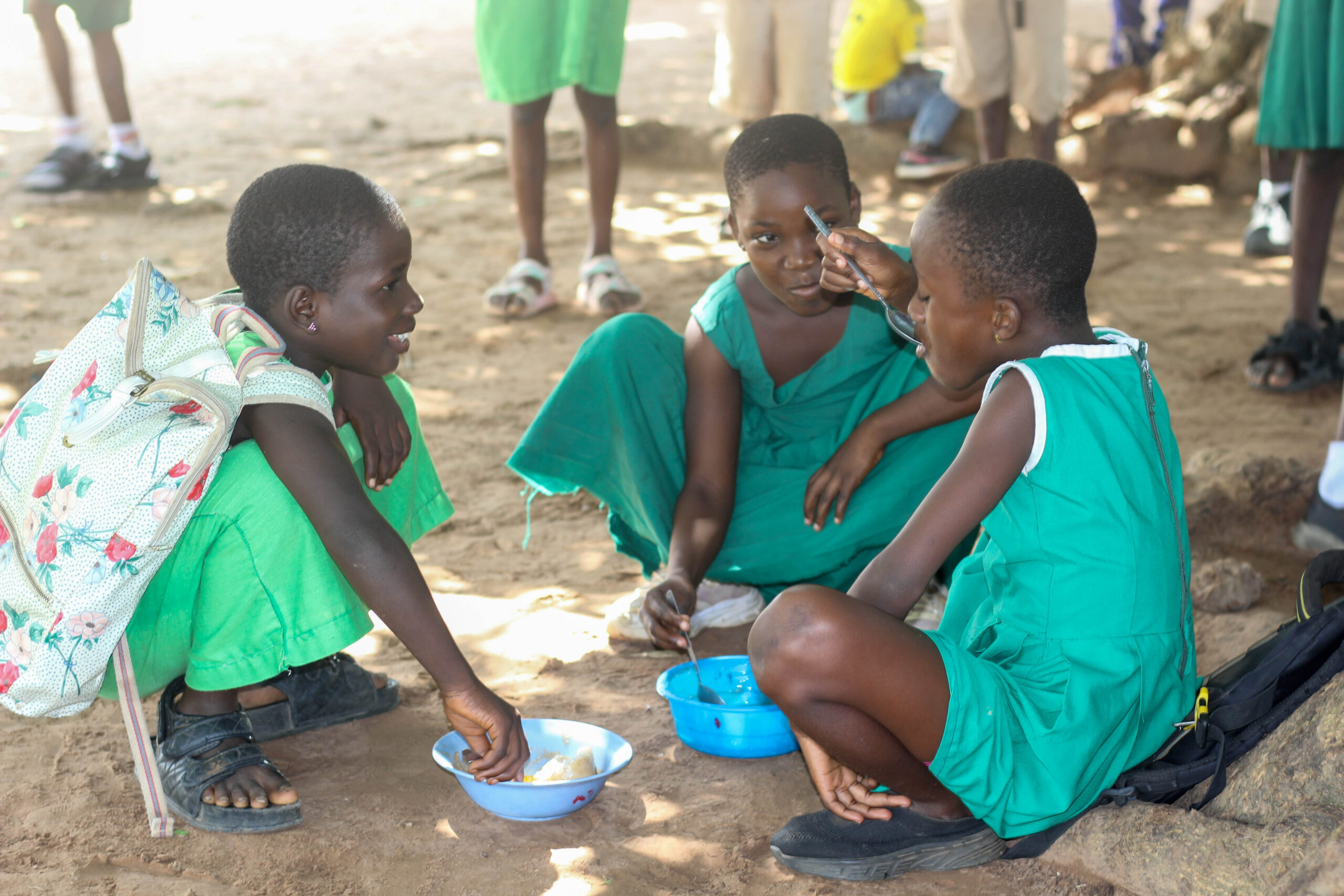 three young girls eating together