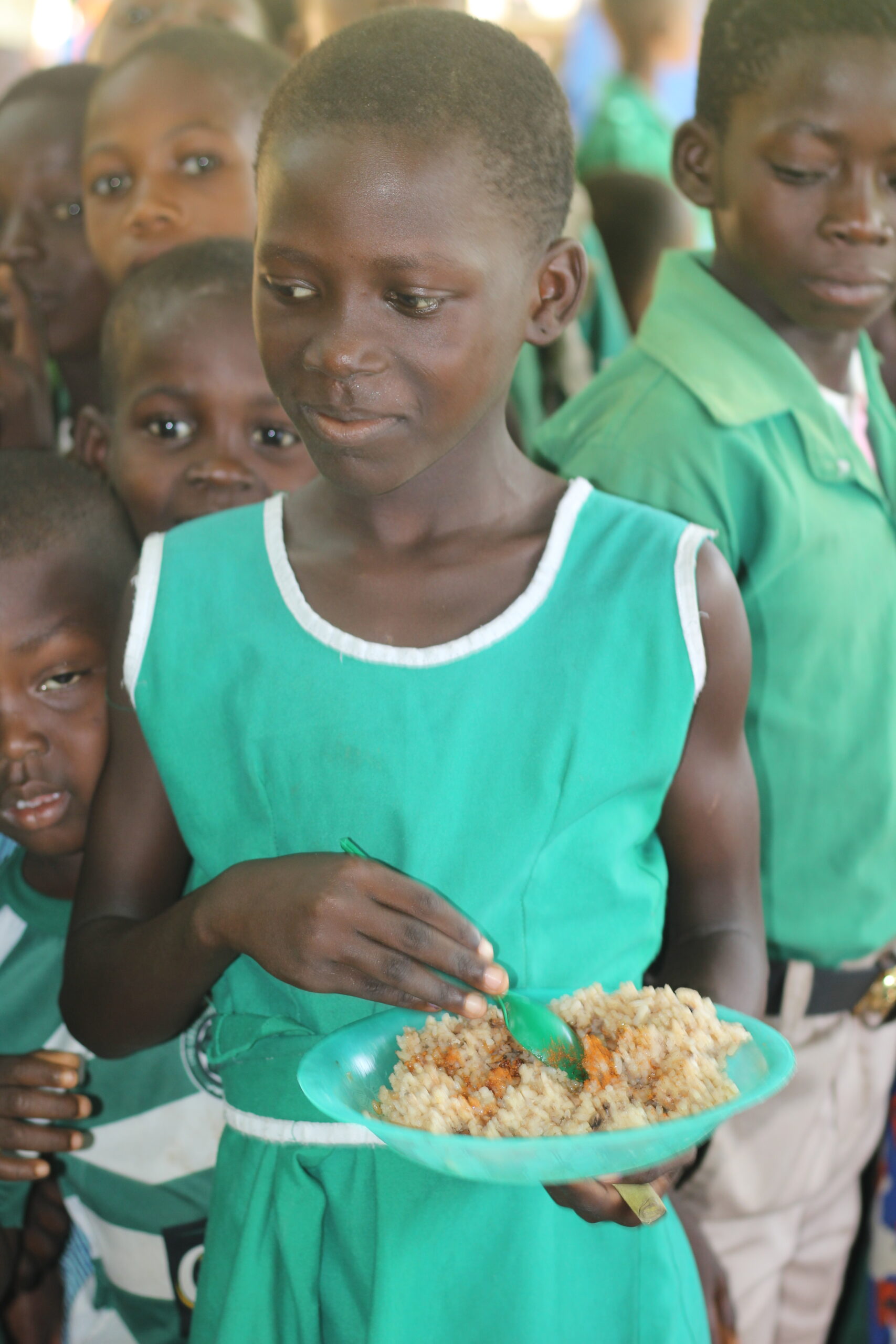 Young school girl eating